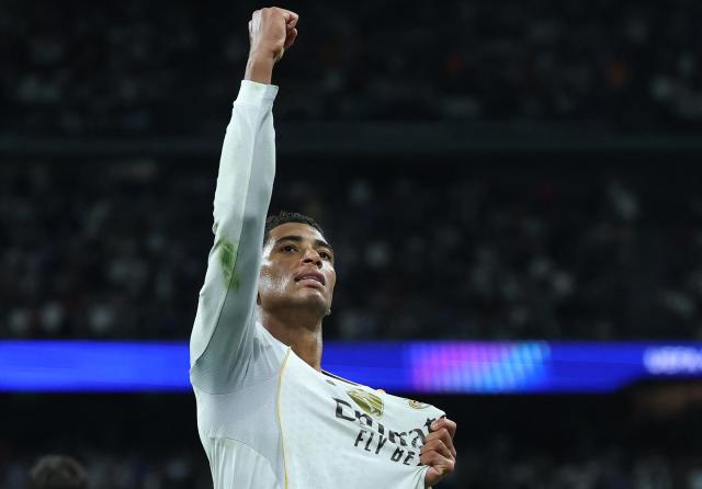 Real Madrid's English midfielder #05 Jude Bellingham celebrates scoring the opening goal during the UEFA Champions League league phase day 3 football match between Real Madrid CF and Juventus at Santiago Bernabeu Stadium in Madrid on October 22, 2025. (Photo by Thomas COEX / AFP)