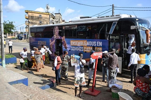 Supporters of former Ivorian First Lady and presidential candidate for the Movement of the Capable Generations (MGC), Simone Ehivet Gbagbo, arrive for a campaign rally at Le Barron, in the working-class commune of Yopougon in Abidjan on October 22, 2025. The presidential election is scheduled for October 25, 2025. (Photo by Sia KAMBOU / AFP)