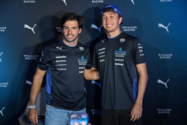 Williams' Spanish driver Carlos Sainz and his Thai teammate Alexander Albon pose for a photo during a media event in Mexico City on October 22, 2025. (Photo by Yuri CORTEZ / AFP)