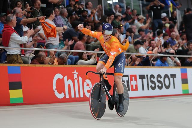 Netherlands' #166 Jeffrey Hoogland celebrates after winning the men's team sprint final during the 2025 UCI Track World Championships at the Peñalolen Velodrome, in Santiago, on October 22, 2025. (Photo by Javier TORRES / AFP)