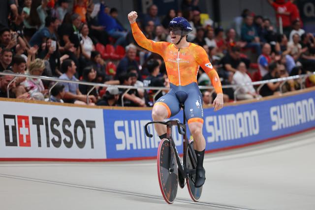 Netherlands' #168 Harrie Lavreysen celebrates after winning the men's team sprint final during the 2025 UCI Track World Championships at the Peñalolen Velodrome, in Santiago, on October 22, 2025. (Photo by Javier TORRES / AFP)