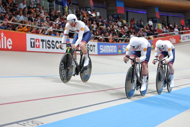 Great Britain's #120 Harry Ledingham-Horn, #121 Matthew Richardson, and #124 Joseph Truman compete in the men's team sprint final during the 2025 UCI Track World Championships at the Peñalolen Velodrome in Santiago on October 22, 2025. (Photo by Javier TORRES / AFP)