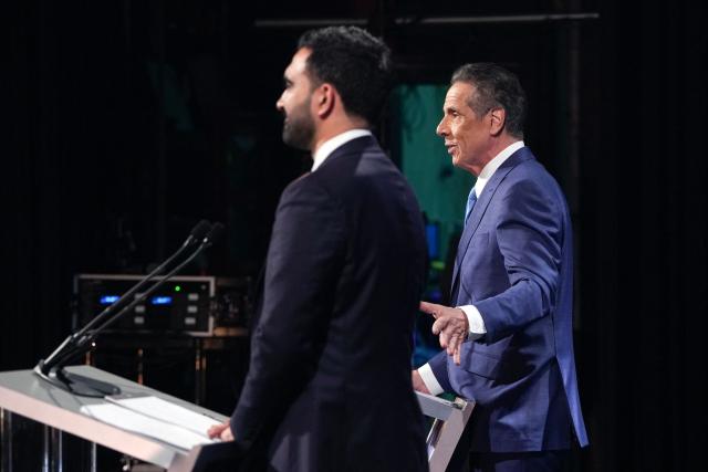 Independent candidate and former New York Governor Andrew Cuomo (R) and Democratic candidate Zohran Mamdani participate in the second New York City mayoral debate with Republican candidate Curtis Sliwa at LaGuardia Performing Arts Center at LaGuardia Community College in Long Island City, Queens, New York, on October 22, 2025. (Photo by Hiroko MASUIKE / POOL / AFP)
