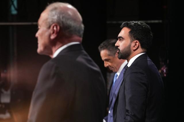 Democratic candidate Zohran Mamdani (R) Republican candidate Curtis Sliwa (L) and Independent candidate and former New York Governor Andrew Cuomo participate in the second New York City mayoral debate at LaGuardia Performing Arts Center at LaGuardia Community College in Long Island City, Queens, New York, on October 22, 2025. (Photo by Hiroko MASUIKE / POOL / AFP)