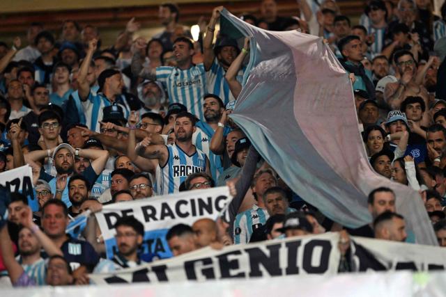 Racing fans cheer for their team ahead of the Copa Libertadores semifinal first leg football match between Brazil's Flamengo and Argentina's Racing at the Maracana stadium in Rio de Janeiro, Brazil on October 22, 2025. (Photo by Mauro PIMENTEL / AFP)