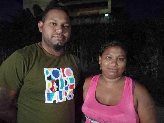 Brandon Will and his sister Sallycar Korasingh, relatives of Rishi Samaroo, pose for a photo near Port of Spain, Trinidad and Tobago on October 22, 2025. The family of one of the two Trinidadians killed in the US strike on a suspected drug trafficking boat, announced on October 14 by Donald Trump, told AFP that their relative had contacted them by video call just before boarding a ship in Venezuela bound for Trinidad and Tobago. (Photo by AFP)