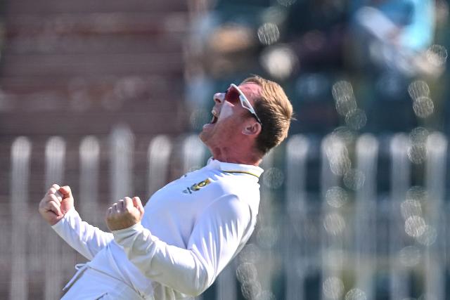 South Africa's Simon Harmer celebrates after taking the wicekt of Pakistan's Babar Azam during the fourth day of the second Test cricket match between Pakistan and South Africa at the Rawalpindi Cricket Stadium in Rawalpindi on October 23, 2025. (Photo by Aamir QURESHI / AFP)