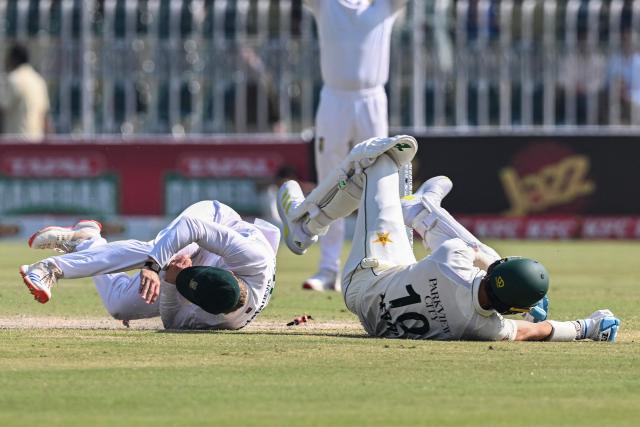 Pakistan's Shaheen Shah Afridi (R) collides with South Africa's Ryan Rickelton after being run out by him during the fourth day of the second Test cricket match between Pakistan and South Africa at the Rawalpindi Cricket Stadium in Rawalpindi on October 23, 2025. (Photo by Aamir QURESHI / AFP)
