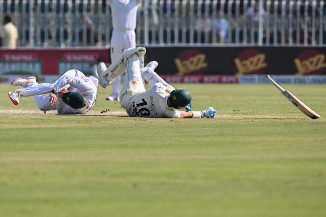 Pakistan's Shaheen Shah Afridi (R) collides with South Africa's Ryan Rickelton after being run out by him during the fourth day of the second Test cricket match between Pakistan and South Africa at the Rawalpindi Cricket Stadium in Rawalpindi on October 23, 2025. (Photo by Aamir QURESHI / AFP)
