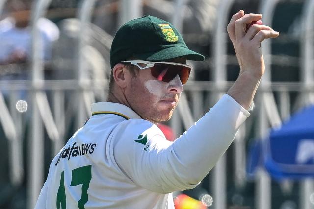 South Africa's Simon Harmer acknowledges the spectators after taking a five-wicket haul during the fourth day of the second Test match between Pakistan and South Africa at the Rawalpindi Cricket Stadium in Rawalpindi on October 23, 2025. (Photo by Aamir QURESHI / AFP)