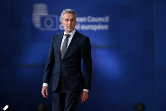 Netherlands' outgoing Prime Minister Dick Schoof arrives for a European Council meeting gathering the 27 EU leaders to discuss Ukraine, European defence, recent developments in the Middle East, competitiveness, housing and migration, in Brussels on October 23, 2025. (Photo by NICOLAS TUCAT / AFP)