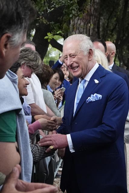King Charles III and Queen Camilla meet members of the public outside the Papal Basilica and Abbey of St Paul's Outside the Wall after a service in Rome on October 23, 2025. (Photo by Aaron Chown / POOL / AFP)