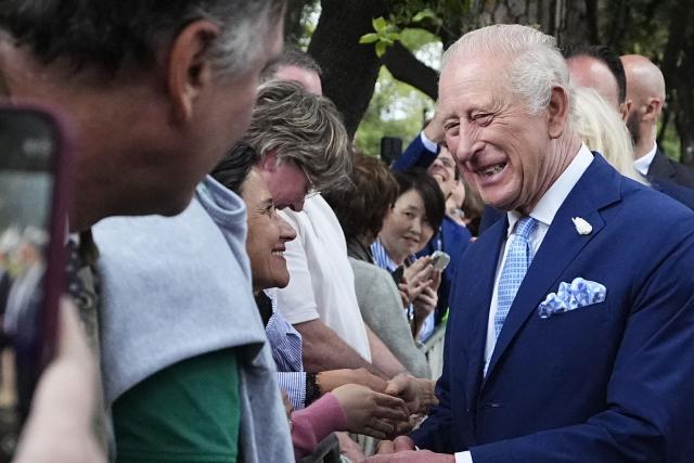 King Charles III and Queen Camilla meet members of the public outside the Papal Basilica and Abbey of St Paul's Outside the Wall after a service in Rome on October 23, 2025. (Photo by Aaron Chown / POOL / AFP)
