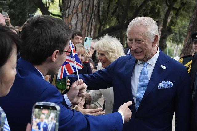 King Charles III and Queen Camilla meet members of the public outside the Papal Basilica and Abbey of St Paul's Outside the Wall after a service in Rome on October 23, 2025. (Photo by Aaron Chown / POOL / AFP)