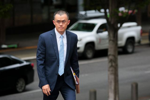 (FILES) Former Binance CEO Changpeng "CZ" Zhao arrives at federal court in Seattle, Washington, on April 30, 2024. The White House announced on October 23, 2025, that US President Donald Trump has issued a pardon for Binance founder Changpeng Zhao. Zhao had pleaded guilty to money laundering charges in late 2023 as part of a $4.3 billion settlement between Binance and the Department of Justice. (Photo by Jason Redmond / AFP)