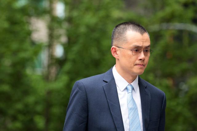 (FILES) Former Binance CEO Changpeng "CZ" Zhao arrives at federal court in Seattle, Washington, on April 30, 2024. The White House announced on October 23, 2025, that US President Donald Trump has issued a pardon for Binance founder Changpeng Zhao. Zhao had pleaded guilty to money laundering charges in late 2023 as part of a $4.3 billion settlement between Binance and the Department of Justice. (Photo by Jason Redmond / AFP)