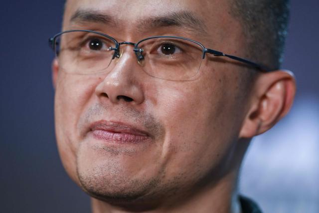 (FILES) Binance Co-Founder and CEO Changpeng Zhao speaks during a press conference at the Europe's largest tech conference, the Web Summit, in Lisbon on November 2, 2022. The White House announced on October 23, 2025, that US President Donald Trump has issued a pardon for Binance founder Changpeng Zhao. Zhao had pleaded guilty to money laundering charges in late 2023 as part of a $4.3 billion settlement between Binance and the Department of Justice. (Photo by PATRICIA DE MELO MOREIRA / AFP)