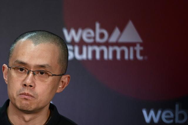 (FILES) Binance Co-Founder and CEO Changpeng Zhao speaks during a press conference at the Europe's largest tech conference, the Web Summit, in Lisbon on November 2, 2022. The White House announced on October 23, 2025, that US President Donald Trump has issued a pardon for Binance founder Changpeng Zhao. Zhao had pleaded guilty to money laundering charges in late 2023 as part of a $4.3 billion settlement between Binance and the Department of Justice. (Photo by PATRICIA DE MELO MOREIRA / AFP)