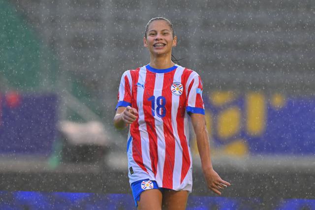(FILES) Paraguay's forward #18 Claudia Martinez celebrates after scoring her team's second goal during the Women's Copa America 2025 football match between Bolivia and Paraguay at the Gonzalo Pozo Ripalda Stadium in Quito on July 13, 2025. Nine women's national teams are lacing up their boots for a historic step: the first South American World Cup qualifying tournament, which experts predict will have new "seasonings" to elevate the competition in women's soccer. (Photo by Rodrigo BUENDIA / AFP)
