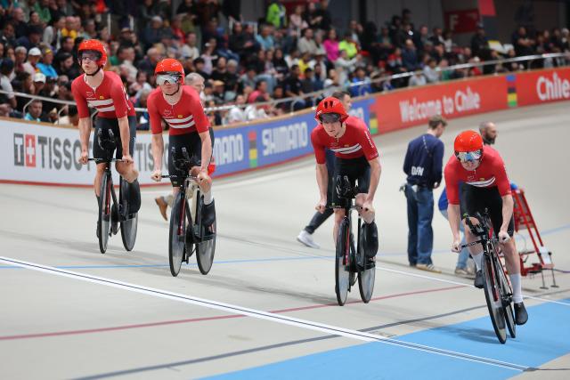 Denmark's  #13 Tobias Hansen, #14 Niklas Larsen, Frederik Madsen and Rasmus Perdersen  competes in the men's team pursuit final event of the 2025 UCI Track World Championships at the Penalolen Velodrome, in Santiago, on October 23, 2025. (Photo by Javier TORRES / AFP)