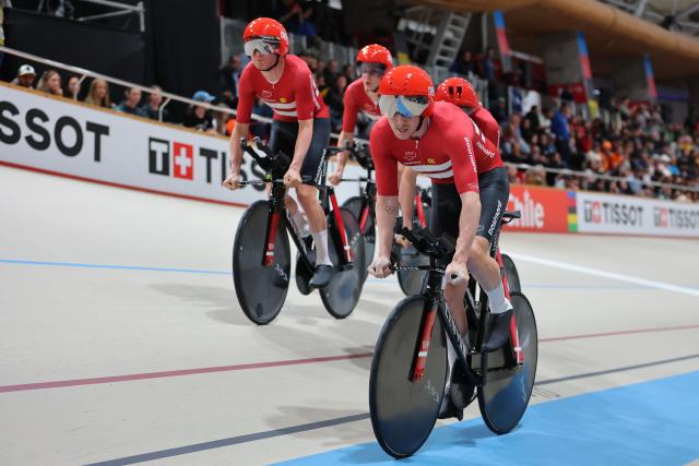 Denmark's #13 Tobias Hansen, #14 Niklas Larsen, Frederik Madsen and Rasmus Perdersen  competes in the men's team pursuit final event of the 2025 UCI Track World Championships at the Penalolen Velodrome, in Santiago, on October 23, 2025. (Photo by Javier TORRES / AFP)