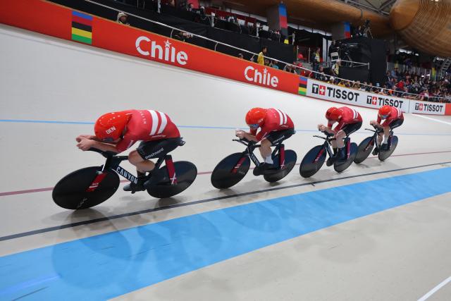 Denmark's #13 Tobias Hansen, #14 Niklas Larsen, Frederik Madsen and Rasmus Perdersen  competes in the men's team pursuit final event of the 2025 UCI Track World Championships at the Penalolen Velodrome, in Santiago, on October 23, 2025. (Photo by Javier TORRES / AFP)