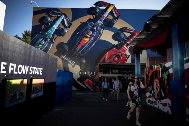 People walk past the media centre of the Mexico City Formula One Grand Prix at the Hermanos Rodriguez racetrack in Mexico City on October 23, 2025. (Photo by Carl DE SOUZA / AFP)