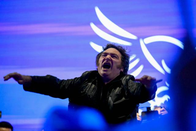 Argentina's President Javier Milei gestures during the closing campaign rally of Libertad Avanza party ahead of the upcoming legislative elections in Rosario, Santa Fe province, Argentina on October 23, 2025. Milei, once a global poster boy for budget-slashing libertarian politics, is heading into the polls diminished by his failure to stabilize Argentina's ailing peso despite spending nearly all the Central Bank's dollar reserves to prop it up. (Photo by Luis ROBAYO / AFP)