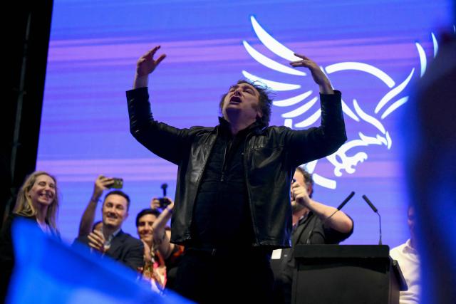 Argentina's President Javier Milei gestures during the closing campaign rally of Libertad Avanza party ahead of the upcoming legislative elections in Rosario, Santa Fe province, Argentina on October 23, 2025. Milei, once a global poster boy for budget-slashing libertarian politics, is heading into the polls diminished by his failure to stabilize Argentina's ailing peso despite spending nearly all the Central Bank's dollar reserves to prop it up. (Photo by Luis ROBAYO / AFP)