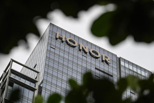 This photo taken on October 21, 2025 shows the logo of Chinese smartphone company Honor at its headquarter in Shenzhen, in southern China's Guangdong province. (Photo by Jade GAO / AFP)