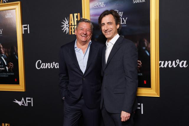 US Netflix co-CEO Ted Sarandos (L) and US filmmaker Noah Baumbach attend the AFI opening night premiere of "Jay Kelly" at the TCL Chinese Theatre in Hollywood, California on October 23, 2025. (Photo by VALERIE MACON / AFP)