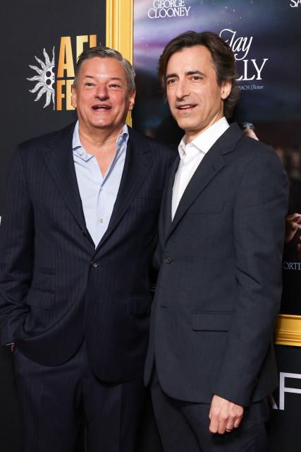 US Netflix co-CEO Ted Sarandos (L) and US filmmaker Noah Baumbach attend the AFI opening night premiere of "Jay Kelly" at the TCL Chinese Theatre in Hollywood, California on October 23, 2025. (Photo by VALERIE MACON / AFP)