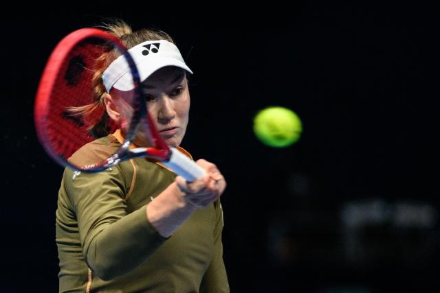 Kazakhstan's Elena Rybakina hits a return to Canada's Victoria Mboko during their women's singles match at the Pan Pacific Open tennis tournament in Tokyo on October 24, 2025. (Photo by Philip FONG / AFP)