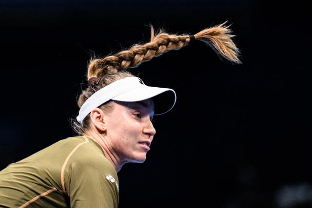 Kazakhstan's Elena Rybakina serves against Canada's Victoria Mboko during their women's singles match at the Pan Pacific Open tennis tournament in Tokyo on October 24, 2025. (Photo by Philip FONG / AFP)