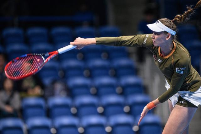 Kazakhstan's Elena Rybakina serves against Canada's Victoria Mboko during their women's singles match at the Pan Pacific Open tennis tournament in Tokyo on October 24, 2025. (Photo by Philip FONG / AFP)