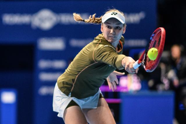 Kazakhstan's Elena Rybakina hits a return to Canada's Victoria Mboko during their women's singles match at the Pan Pacific Open tennis tournament in Tokyo on October 24, 2025. (Photo by Philip FONG / AFP)