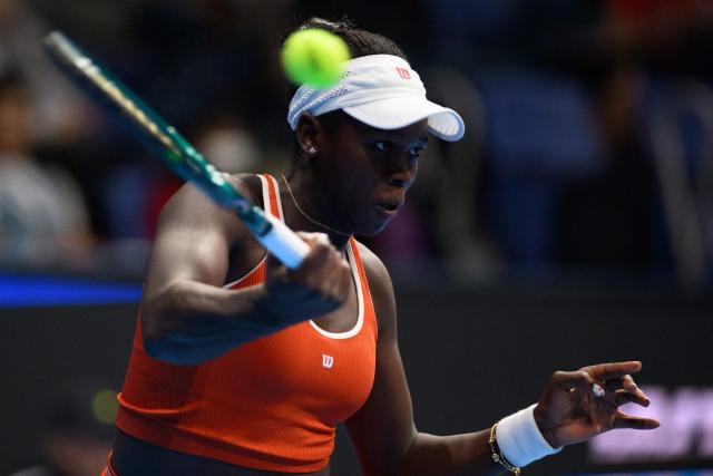 Canada's Victoria Mboko hits a return to Kazakhstan's Elena Rybakina during their women's singles match at the Pan Pacific Open tennis tournament in Tokyo on October 24, 2025. (Photo by Philip FONG / AFP)
