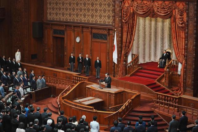 Japan's Emperor Naruhito (top, R) attends the opening ceremony of the extraordinary Diet session in Tokyo on October 24, 2025. (Photo by Kazuhiro NOGI / AFP)