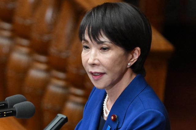 Japan's Prime Minister Sanae Takaichi delivers a speech at the House of Representatives plenary session in Tokyo on October 24, 2025. Japan's new prime minister Sanae Takaichi said on October 24 she would try to achieve the country's target of spending two percent of GDP on defence two years early. (Photo by Kazuhiro NOGI / AFP)
