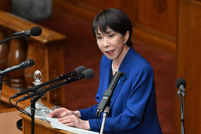 Japan's Prime Minister Sanae Takaichi delivers a speech at the House of Representatives plenary session in Tokyo on October 24, 2025. Japan's new prime minister Sanae Takaichi said on October 24 she would try to achieve the country's target of spending two percent of GDP on defence two years early. (Photo by Kazuhiro NOGI / AFP)