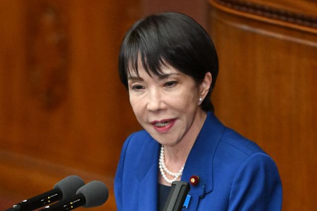 Japan's Prime Minister Sanae Takaichi delivers a speech at the House of Representatives plenary session in Tokyo on October 24, 2025. Japan's new prime minister Sanae Takaichi said on October 24 she would try to achieve the country's target of spending two percent of GDP on defence two years early. (Photo by Kazuhiro NOGI / AFP)