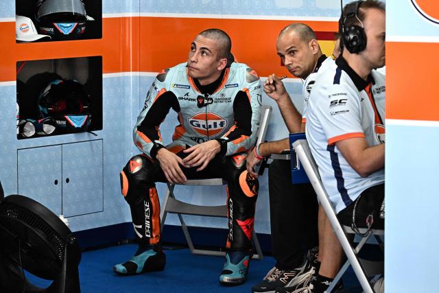 Trackhouse MotoGP's Spanish rider Raul Fernandez (L) rests during the first practice of the MotoGP Malaysian Grand Prix at the Sepang International Circuit in Sepang on October 24, 2025. (Photo by Lillian SUWANRUMPHA / AFP)