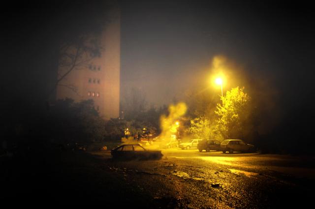 (FILES) A car is burning overnight in Lyon Minguettes popular district on November 11, 2025. On October 27, 2005, Zyed Benna and Bouna Traore, aged 17 and 15, died from electrocution in an EDF power substation where they had taken refuge after being chased by the police. This tragedy sparked a series of riots that spread from Clichy-sous-Bois to the rest of the country for three weeks, leading to the declaration of a state of emergency. (Photo by Jean-Philippe KSIAZEK / AFP)