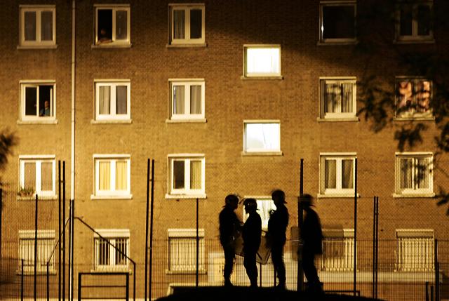 (FILES) A picture taken early 08 November 2005 shows riot policemen patrolling in the Bethune suburb of the town of Lille, northern France. On October 27, 2005, Zyed Benna and Bouna Traore, aged 17 and 15, died from electrocution in an EDF power substation where they had taken refuge after being chased by the police. This tragedy sparked a series of riots that spread from Clichy-sous-Bois to the rest of the country for three weeks, leading to the declaration of a state of emergency. (Photo by PHILIPPE HUGUEN / AFP)