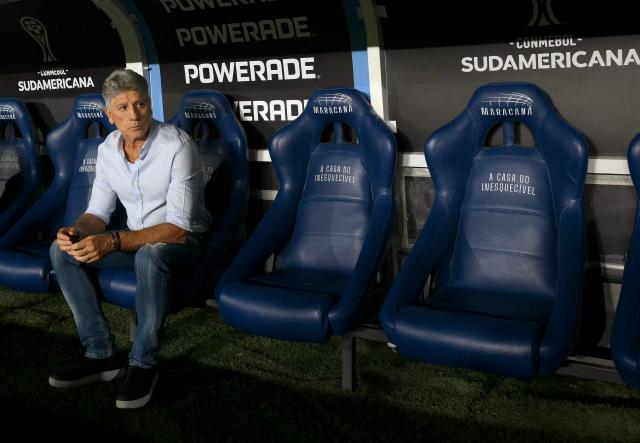(FILES) Fluminense's head coach Renato Gaucho sits on the bench ahead of the Copa Sudamericana quarterfinal second leg football match between Brazil's Fluminense and Argentina's Lanus at the Maracana Stadium in Rio de Janeiro, Brazil on September 23, 2025. 'Social media has ruined football,' protested Renato Gaucho when he announced his unexpected resignation as coach of Fluminense in Rio de Janeiro. His words reflect growing concern over the digital pressure faced by coaches in modern football. (Photo by Mauro PIMENTEL / AFP)