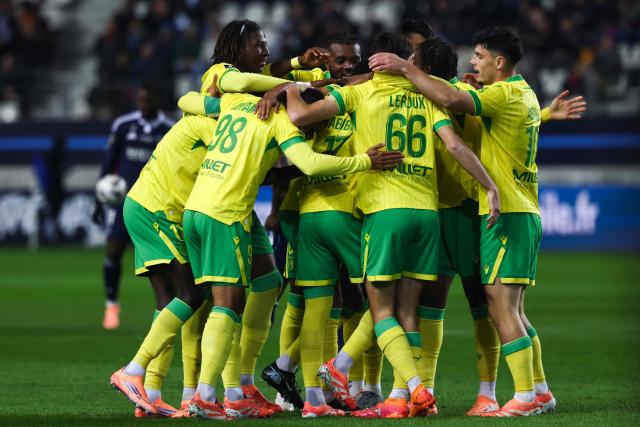 Nantes' players celebrate after scoring their team first goal during the French L1 football match between Paris FC and FC Nantes at the Stade Jean-Bouin in Paris on October 24, 2025. (Photo by FRANCK FIFE / AFP)