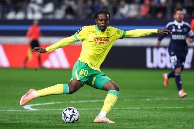 Nantes' French Congolese midfielder #80 Junior Mwanga shoots the ball during the French L1 football match between Paris FC and FC Nantes at the Stade Jean-Bouin in Paris on October 24, 2025. (Photo by FRANCK FIFE / AFP)