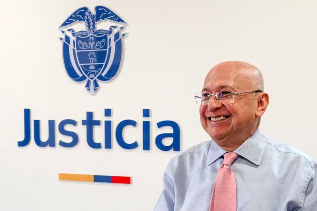 (FILES) Colombia's Minister of Justice Eduardo Montealegre gestures during an interview with AFP in Bogota on June 26, 2025. Montealegre submitted his “irrevocable” resignation to Gustavo Petro's government on October 24, 2025 to focus on challenging the recent acquittal of former President Alvaro Uribe in a case involving bribery and procedural fraud. (Photo by Anne-Sophie THILL / AFP)
