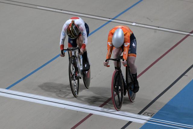 Japan's #116 Mina Sato and Netherlands' #122 Hetty Van de Wouw compete in the women's sprint event final at the 2025 UCI Track World Championships, in the Penalolen Velodrome in Santiago, on October 24, 2025. (Photo by Rodrigo ARANGUA / AFP)