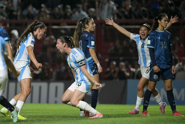 Argentina's defender #06 Aldana Cometti (2nd-L) celebrates with teammates after scoring her team's first goal during the Conmebol Women's Nations League 2025-26 football match between Argentina and Paraguay at the Diego Armando Maradona Stadium in Buenos Aires on October 24, 2025. (Photo by JUAN MABROMATA / AFP)